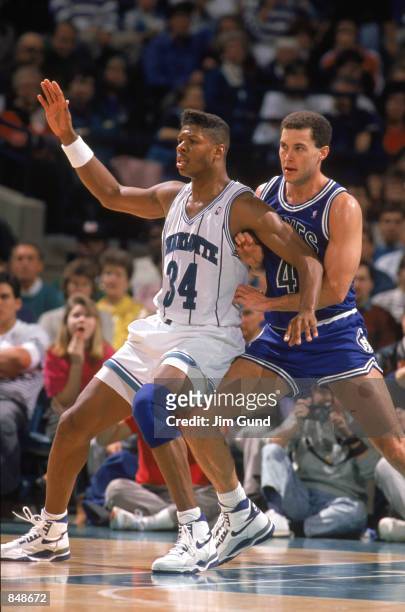Reid of the Charlotte Hornets posts up during an NBA game at Charlotte Colesium in 1989.
