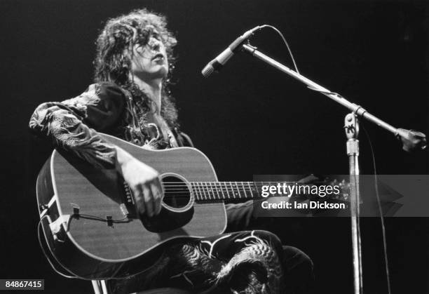 Photo of Jimmy PAGE and LED ZEPPELIN, Jimmy Page performing live onstage, playing acoustic guitar