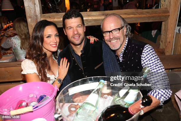 Michael Ballack and his girlfriend Natacha Tannous and Peter Olsson during the 'Almauftrieb' as part of the Oktoberfest 2017 at Kaeferschaenke Tent...