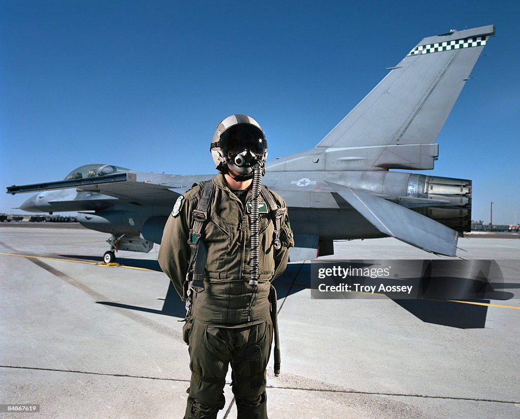 Fighter pilot in front of jet