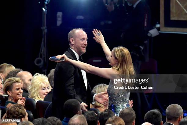 Actors Matt Walsh and Anna Chlumsky embrace during the 69th Annual Primetime Emmy Awards at Microsoft Theater on September 17, 2017 in Los Angeles,...