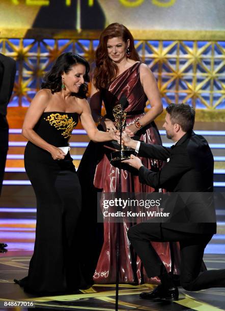 Actor Julia Louis-Dreyfus accepts Outstanding Lead Actress in a Comedy Series for 'Veep' from actor Debra Messing and TV personality Chris Hardwick...