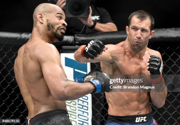Luke Rockhold punches David Branch in their middleweight bout during the UFC Fight Night event inside the PPG Paints Arena on September 16, 2017 in...