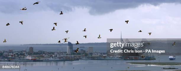 Rain showers move towards Portsmouth and its landmark Spinnaker Tower as rain causes misery for many across the UK, particularly in the north.