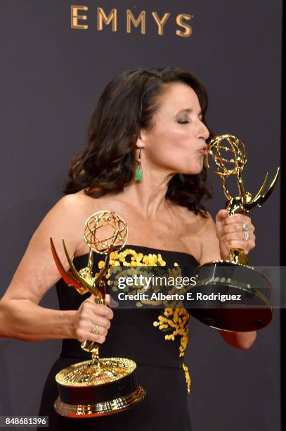Actor Julia Louis-Dreyfus, winner of the award for Outstanding Comedy Actress for 'Veep,' poses in the press room during the 69th Annual Primetime...