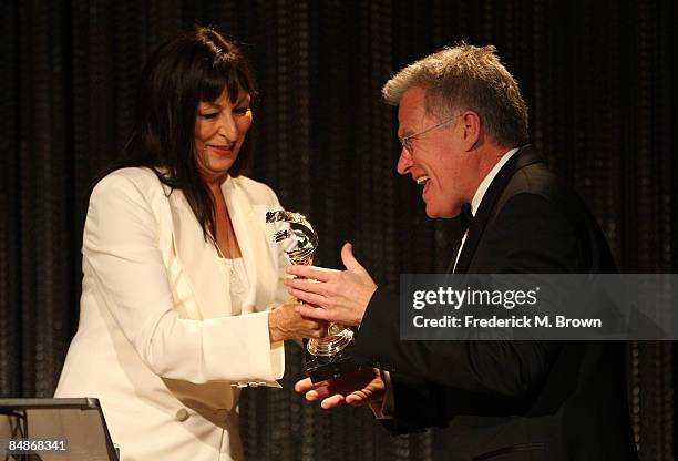 Actress Anjelica Huston presents Costume Designer Van Broughton Ramsey the CarrerAchievement in Television Award during the 11th annual Costume...