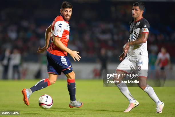 Leandro Diaz of Veracruz and Francisco Rodriguez of Lobos BUAP fight for the ball during the 9th round match between Veracruz and Lobos BUAP as part...