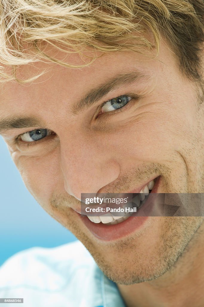 Portrait of a man smiling, close-up