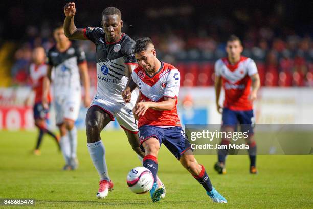 Luis Advincula of Lobos BUAP and Daniel Villalva of Veracruz fight for the ball during the 9th round match between Veracruz and Lobos BUAP as part of...