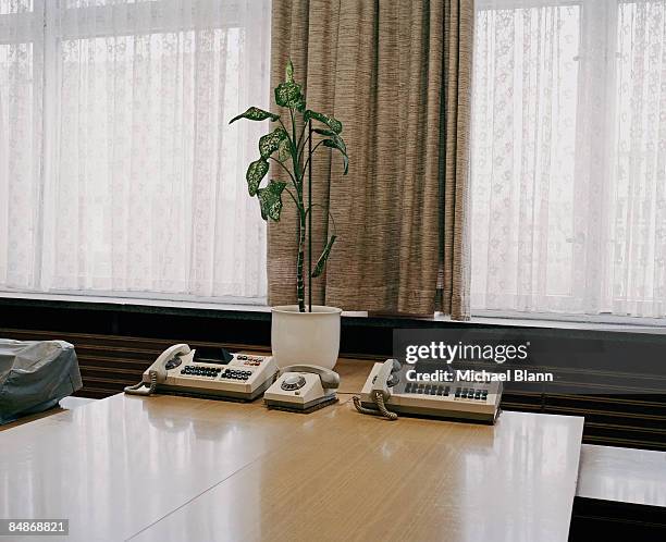 telephones on desk in stasi office - stasi stock-fotos und bilder