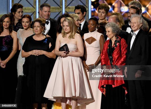 Actor Elisabeth Moss and author Margaret Atwood with cast and crew of 'The Handmaid's Tale' accept the Outstanding Drama Series award onstage during...