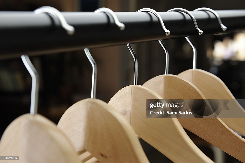 Row of empty hangers in shop