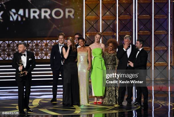 Writer/producer Charlie Brooker with cast and crew accept Outstanding Television Movie for 'Black Mirror' onstage during the 69th Annual Primetime...