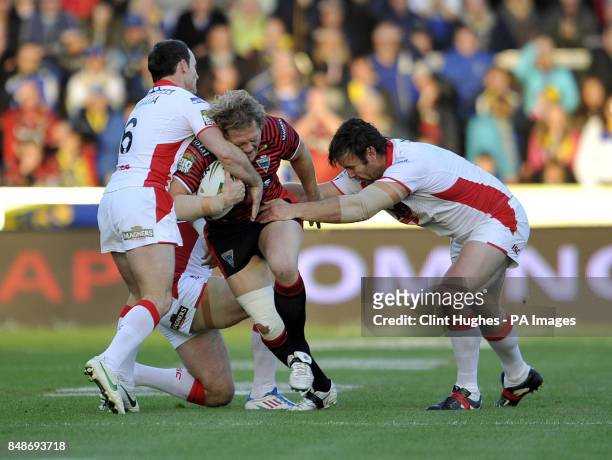 St Helens's Lance Hohaia and Jon Wilkin tackle Warrington Wolves's Ben Westwood during the Stobart Super League Semi Final, Langtree Park, St Helens.