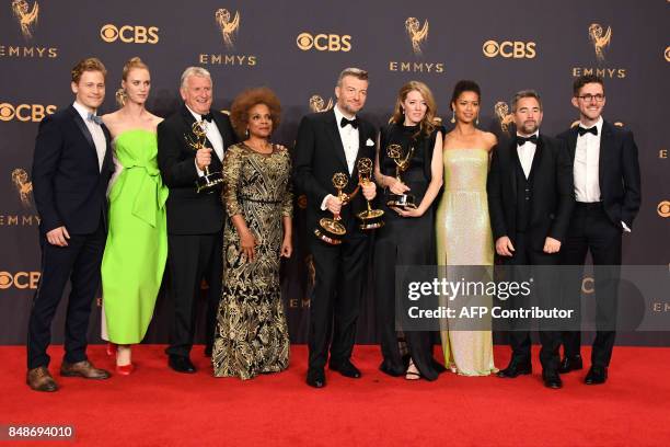 Charlie Brooker and the "Black Mirror" cast pose with the Emmy for Outstanding Writing for a Limited Series, Movie, or Dramatic Special during the...