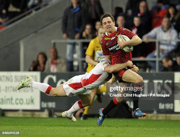 St Helens's Lance Hohaia tackles Warrington Wolves's Richie Myler during the Stobart Super League Semi Final, Langtree Park, St Helens.