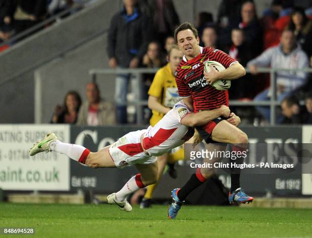 St Helens's Lance Hohaia tackles Warrington Wolves's Richie Myler during the Stobart Super League Semi Final, Langtree Park, St Helens.