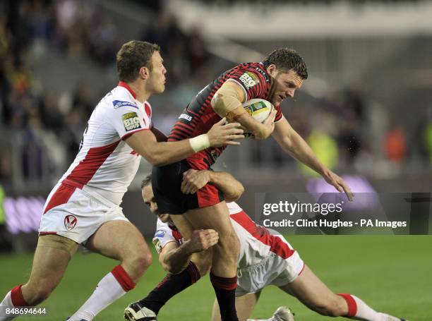 St Helens's Lance Hohaia and Josh Jones tackle Warrington Wolves's Simon Grix during the Stobart Super League Semi Final, Langtree Park, St Helens.