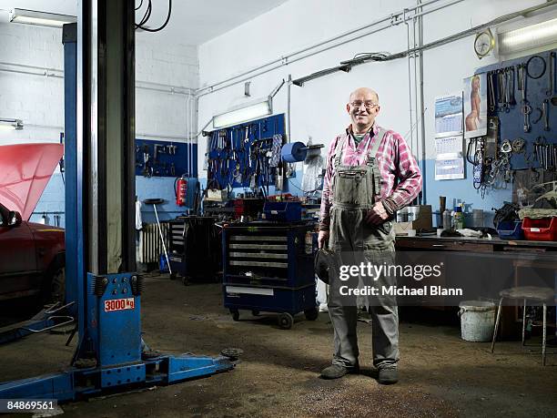 portrait of smiling mechanic in garage - proud old man stock pictures, royalty-free photos & images