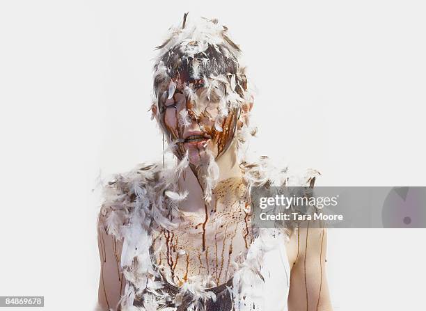 woman covered in tar and feathers - tar stock pictures, royalty-free photos & images