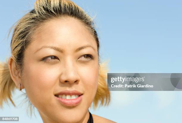 young asian woman against sky - abc1 female 20 years old stock pictures, royalty-free photos & images