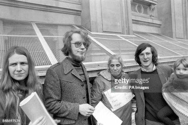 Crispin Aubrey , holding his three-year-old daughter Kate, and fellow journalist Duncan Campbell outside the Home Office, the day after their release...