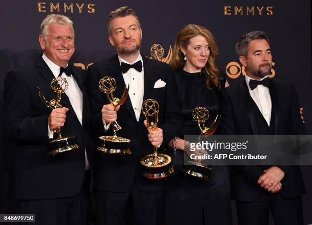 Charlie Brooker and the "Black Mirror" crew pose with the Emmy for Outstanding Writing for a Limited Series, Movie, or Dramatic Special during the...