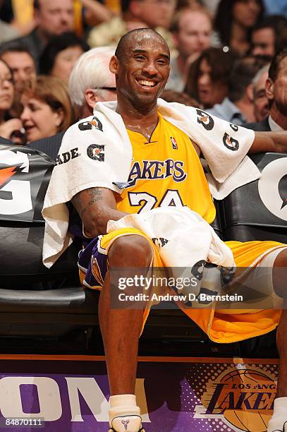 Kobe Bryant 24 of the Los Angeles Lakers smiles from the bench during a game against the Atlanta Hawks at Staples Center on February 17, 2009 in Los...