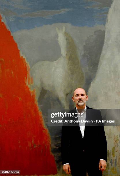 Christopher Le Brun, President of the Royal Academy, poses with his painting 'Golf' during the launch of the RA Now exhibition at the Royal Academy,...