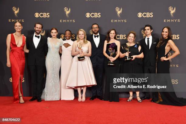 Cast of 'The Handmaid's Tale', winners of Outstanding Drama Series, pose in the press room during the 69th Annual Primetime Emmy Awards at Microsoft...