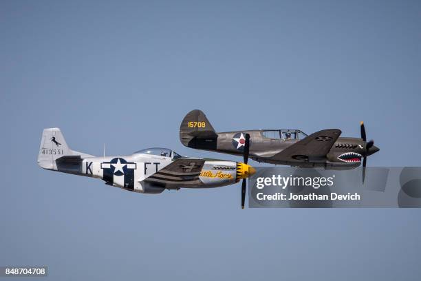 Planes fly close together during an unlimited class race at the Reno Championship Air Races on September 17, 2017 in Reno, Nevada.