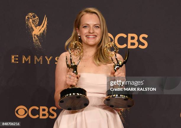 Elisabeth Moss poses with the awards for Outstanding Drama Series and Outstanding Lead Actress in a Drama Series for "The Handmaid's Tale" during the...