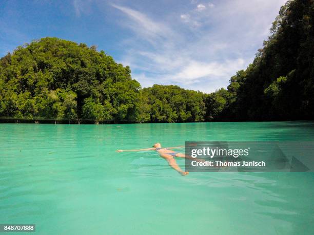 swimming in the milky way lagoon, rock islands, palau - palau stock pictures, royalty-free photos & images