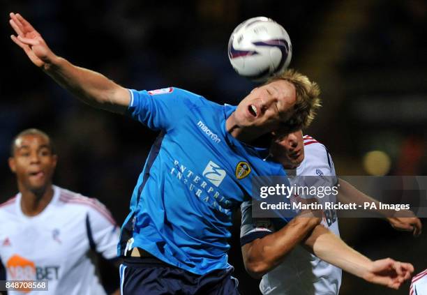 Leeds United's Luciano Becchio battles with Bolton Wanderers Stephen Warnock during the npower Championship match at the Reebok Stadium, Bolton.