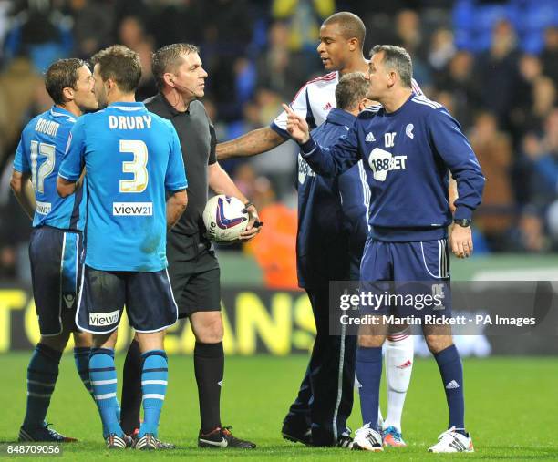 Bolton Wanderers manager Owen Coyle has words with referee Phil Dowd after the npower Championship match at the Reebok Stadium, Bolton.