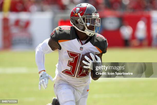 Robert McClain of the Buccaneers intercepts a pass from Mike Glennon and returns the pass for a touchdown during the NFL Regular game between the...