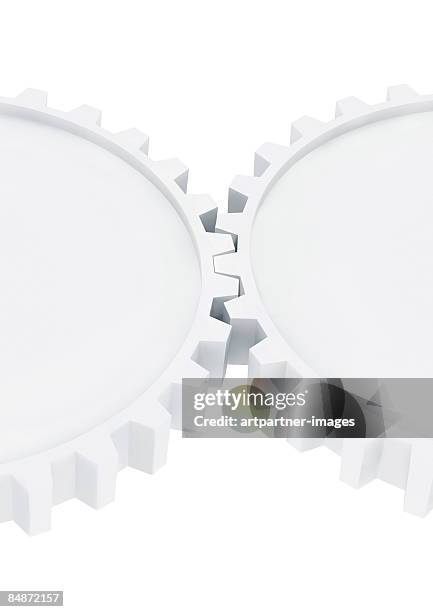 two white gear wheels working together - verzahnt stock-grafiken, -clipart, -cartoons und -symbole