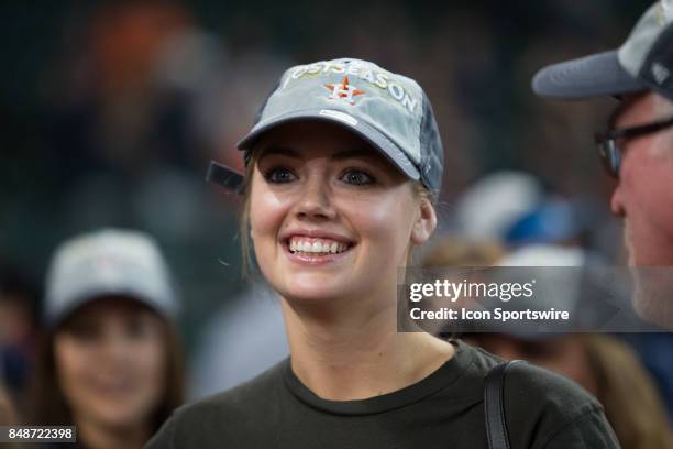 Supermodel Kate Upton waits for Houston Astros starting pitcher Justin Verlander on the field after clinching the Central Division after an MLB game...