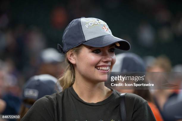 Supermodel Kate Upton waits for Houston Astros starting pitcher Justin Verlander on the field after clinching the Central Division after an MLB game...