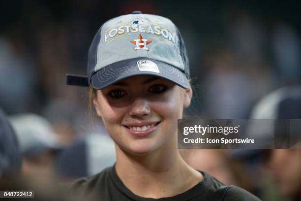 Supermodel Kate Upton waits for Houston Astros starting pitcher Justin Verlander on the field after clinching the Central Division after an MLB game...