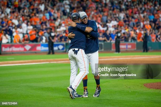 Houston Astros Carlos Correa and Houston Astros Yuli Gurriel celebrate on the field after clinching the Central Division after an MLB game between...