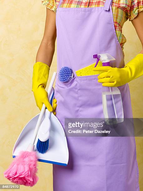 cleaning lady with cleaning materials - dustpan and brush stockfoto's en -beelden