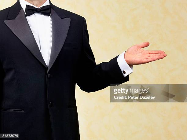 body guard, bouncer, doorman, waiter, welcoming - tuxedo stock-fotos und bilder