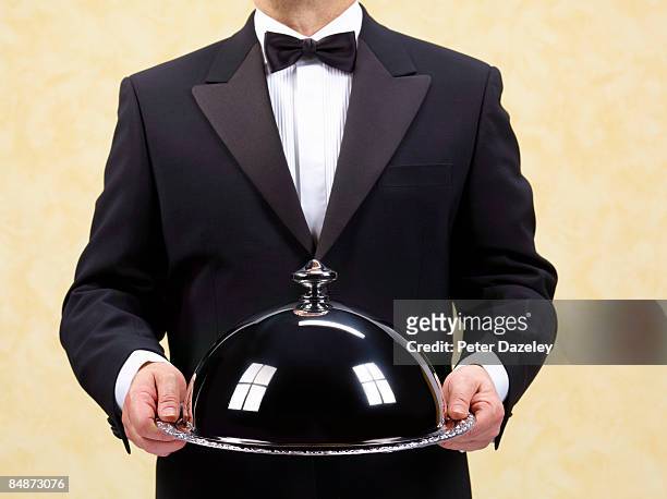 butler, waiter holding domed silver tray, salver. - dinner jacket stock pictures, royalty-free photos & images