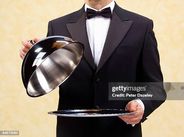 butler waiter holding open domed silver tray. - lid bildbanksfoton och bilder