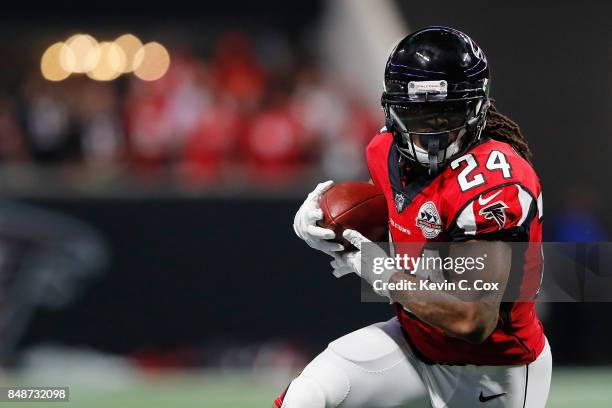 Devonta Freeman of the Atlanta Falcons runs with the ball during the first half against the Green Bay Packers at Mercedes-Benz Stadium on September...