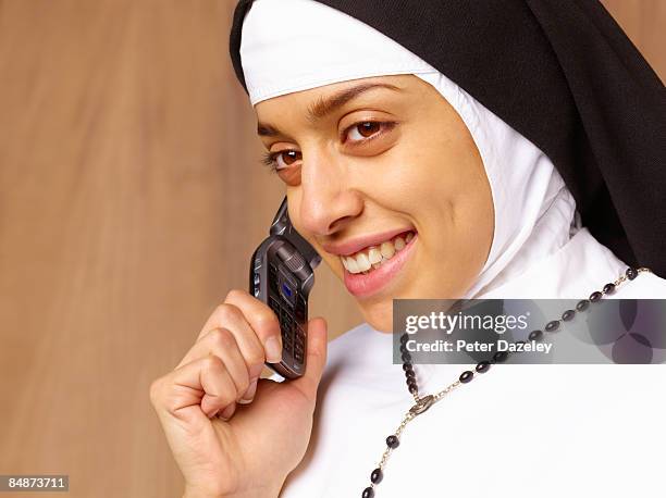 nun talking on mobile phone. - nun habit stock pictures, royalty-free photos & images