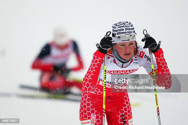 An exhausted Katja Visnar of Slovenia reacts after crossing the finish line during the Ladies 5KM Individual Classic Qualification Race at the FIS...