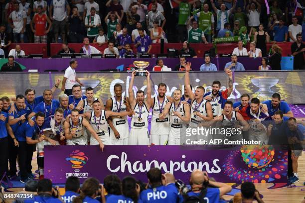 Slovenia's players celebrate with their trophy after defeating Serbia during the FIBA Eurobasket 2017 men's Final basketball match between Slovenia...