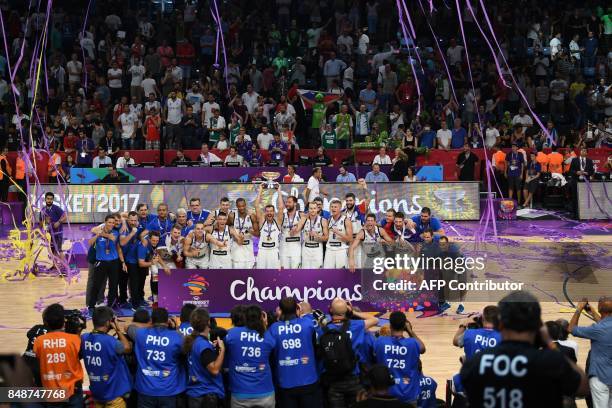 Slovenia's players celebrate with their trophy after defeating Serbia during the FIBA Eurobasket 2017 men's Final basketball match between Slovenia...